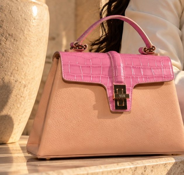 The Monaco, Dubai edition, in blush leather with a pink crocodile embossed flap